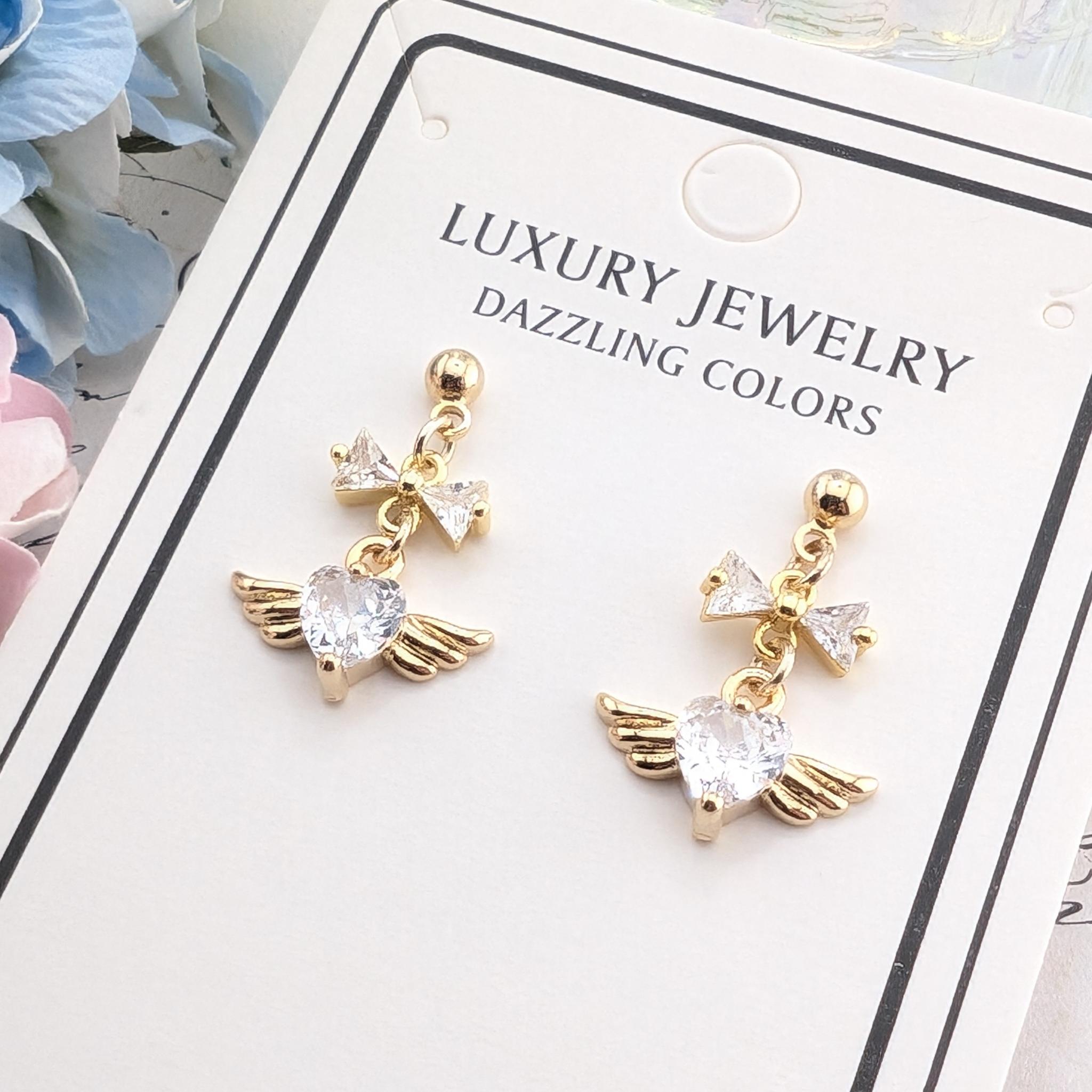 リボンとハートエンジェルのピアス　かわいい　おしゃれ1枚目の画像